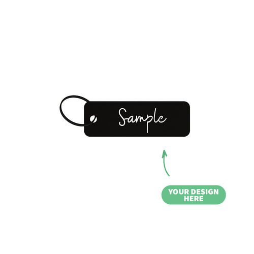 Black customizable steel keychain tag with 'Sample' text on a white background, made in Lebanon
