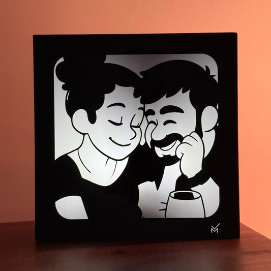 Black framed artwork of two people with a warm orange background gift lebanon Beirut 